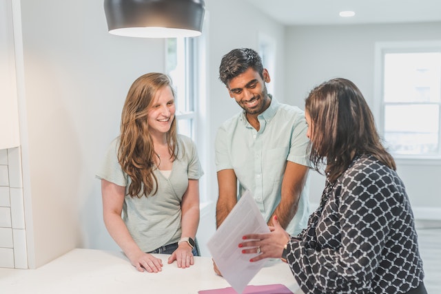 landlord showing an unfurnished property to two tenants